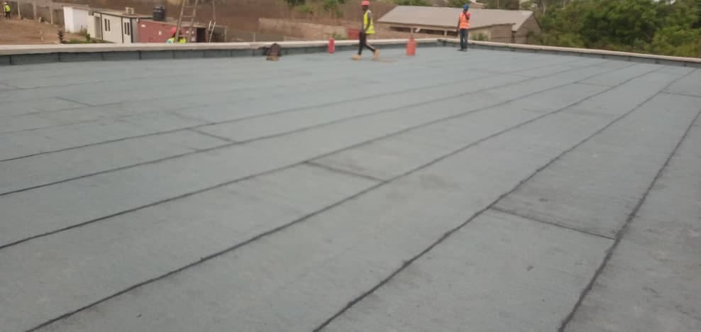 Construction work on the Paouignan substation building — slab waterproofing